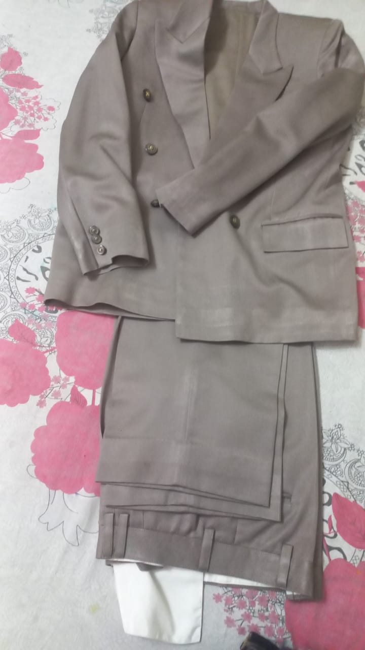Silver coat with design  available for sale