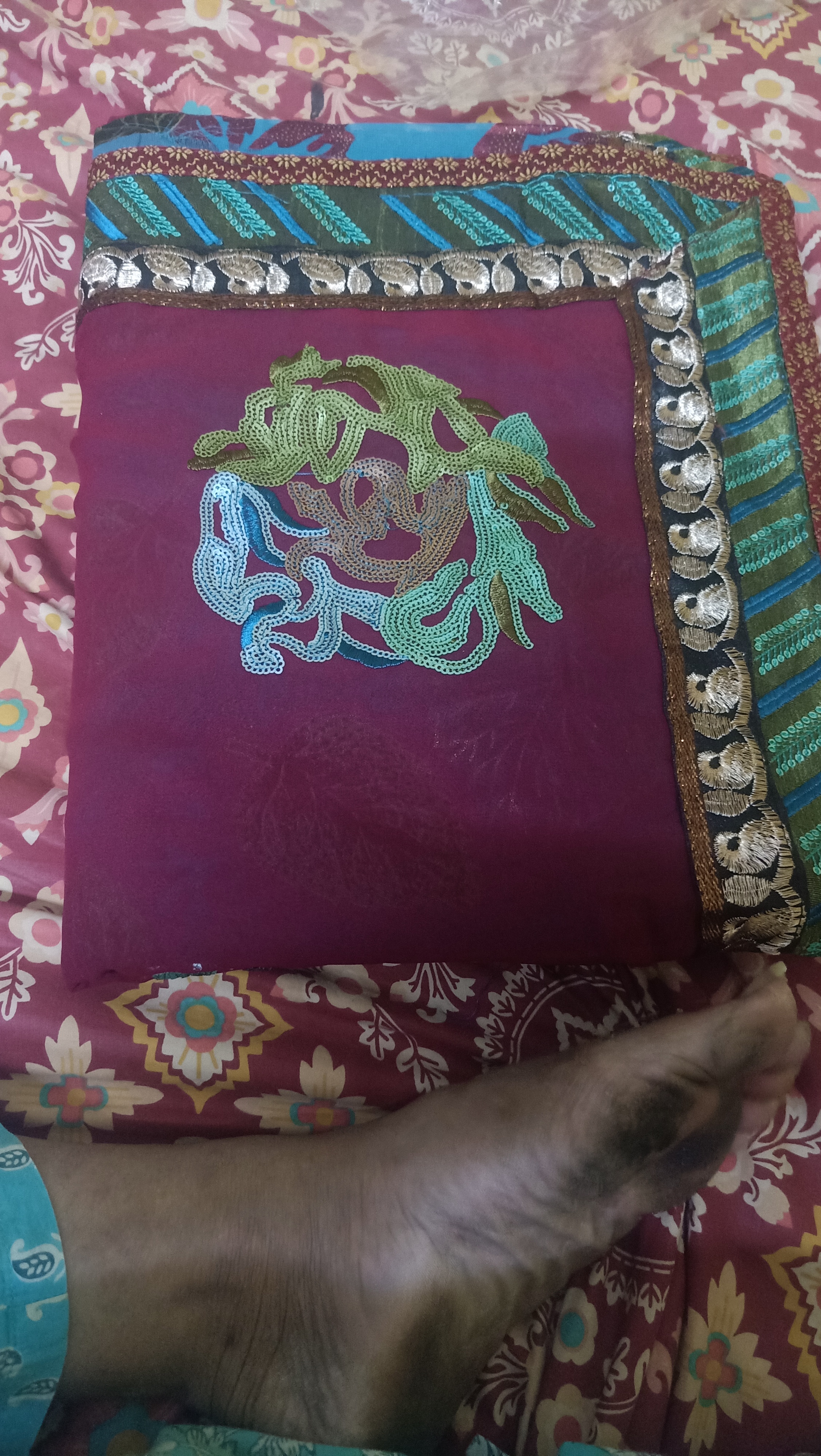 Georgette saree with heavy embroidery.and its maroon in colour. available for sale