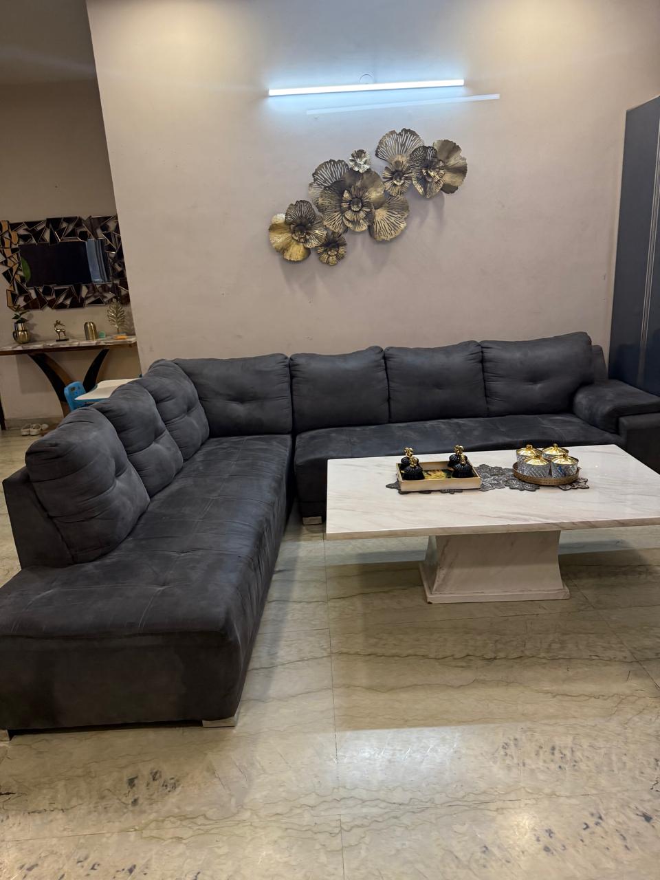 L shaped sofa with marble centre table available for sale