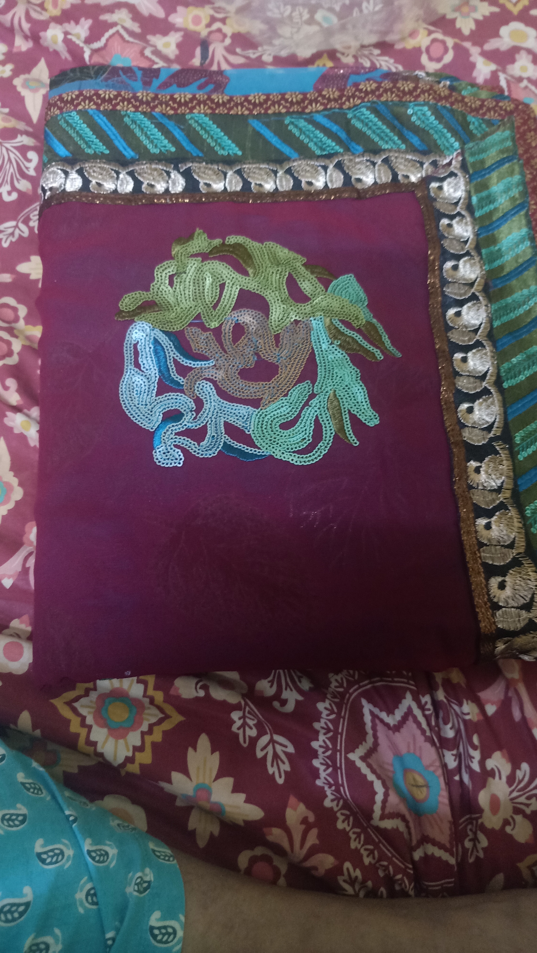 Saree with heavy embroidery board. And it's purple in colour.  available for sale